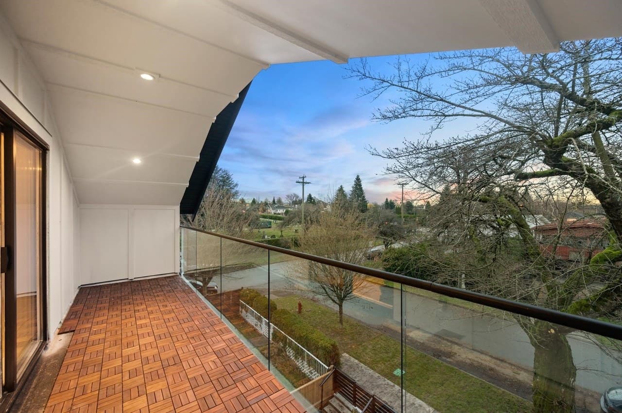 A covered balcony overlooking a Vancouver neighbourhood