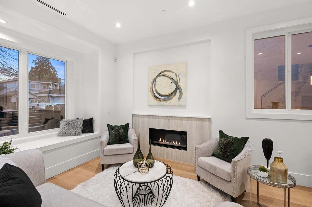 A welcoming living room with a fireplace and natural light